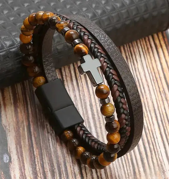 Men’s brown beaded and braided leather bracelet with silver cross charm – stylish and adjustable.