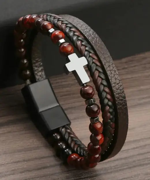 Men’s red beaded and braided leather bracelet with silver cross charm – stylish and adjustable.