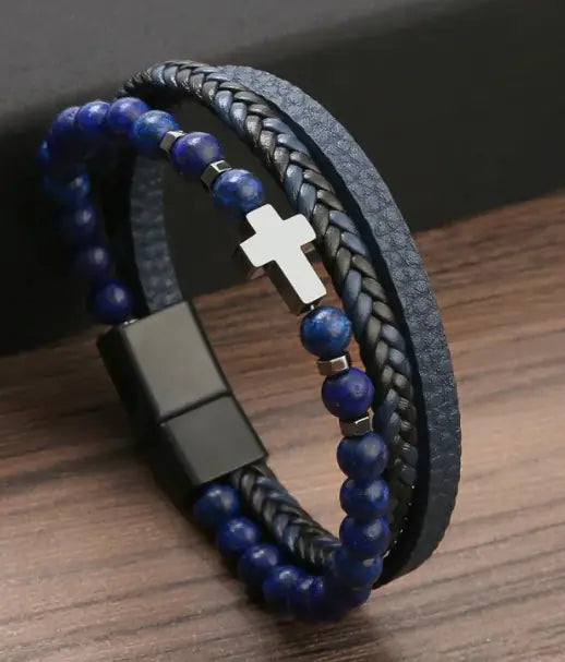 Men’s blue beaded and braided leather bracelet with silver cross charm – stylish and adjustable.