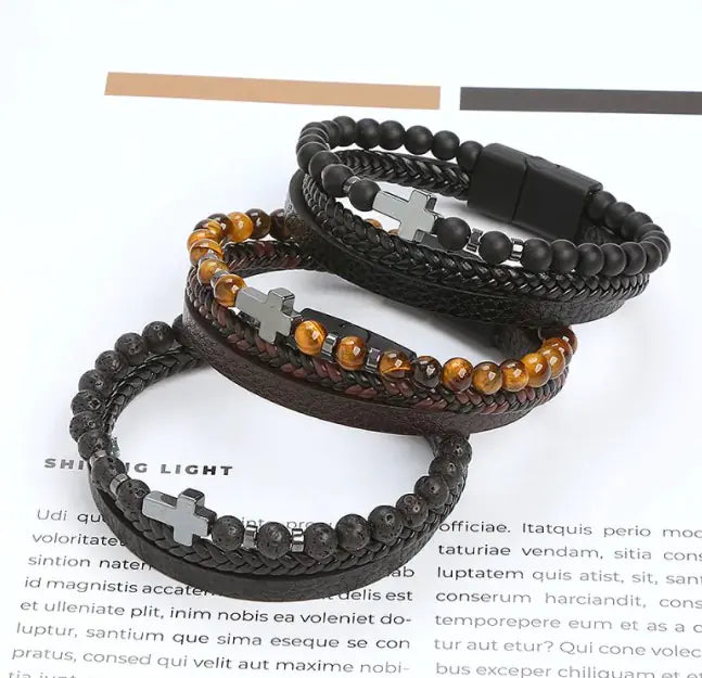 Men’s beaded and braided leather bracelet with silver cross charm – stylish and adjustable.