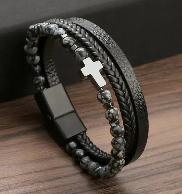Men’s beaded and braided leather bracelet with silver cross charm – stylish and adjustable.